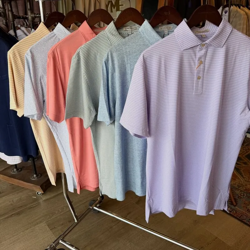 Rack of pastel polo shirts in the store